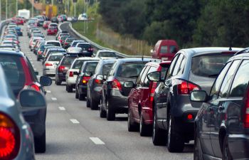 A traffic jam with rows of cars.